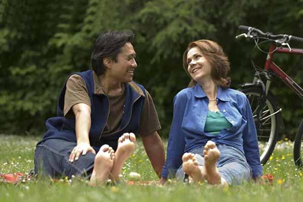 Couple barefoot in park