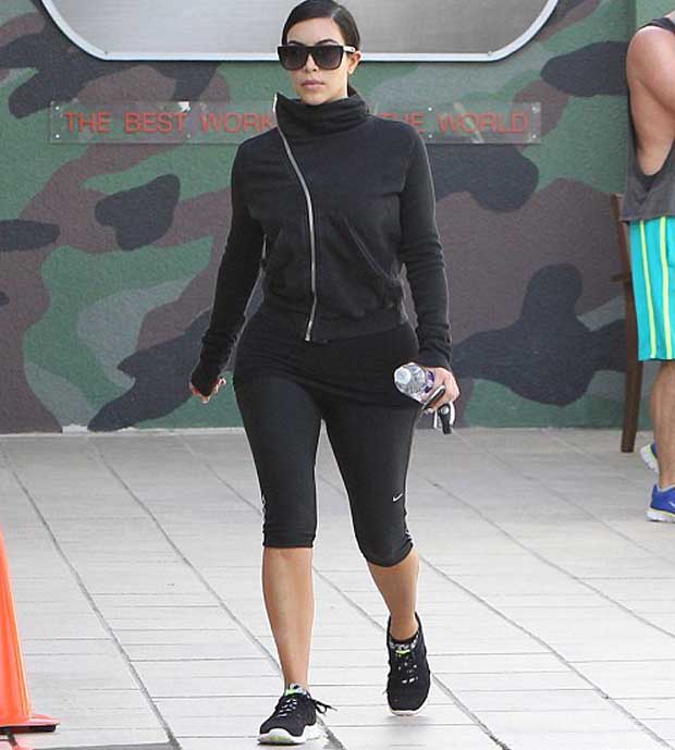 Kim Kardashian in black_jacket and tight leggings