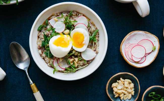 BREAKFAST PORRIDGE WITH SOFT EGG AND PEA SHOOTS