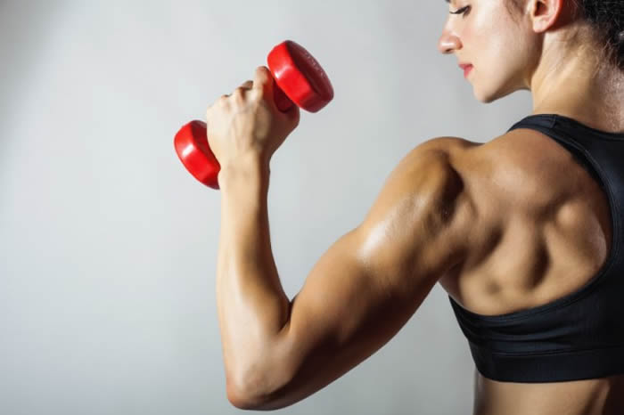 7 Easy Lean Muscle Moves That Only Require 1 Dumbbell