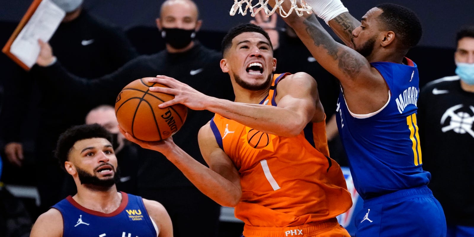  How long is Devin Booker out? Suns guard leaves OT loss with leg injury