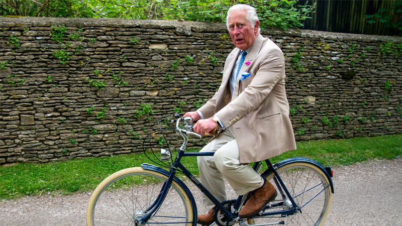  Prince Charles wobbles off on his bicycle, joking: ‘I haven’t worked out the gears’