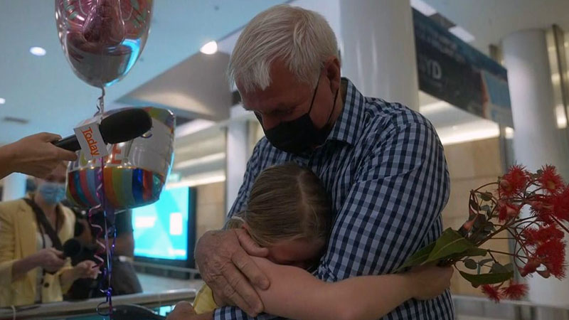  Emotional reunions as first international travelers land in Australia in over 700 days