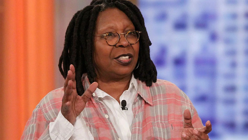  ‘Black People Emerged Suddenly’ Whoopi Goldberg Debuts Folding Chair Pendant on “The View” in Nod to Alabama Riverfront Melee