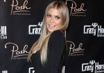 Carmen Electra crams her Curves into LBD for belated Birthday Bash