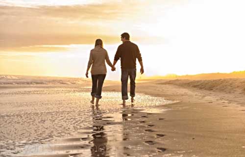 Couple-walking-together-into-the-sunset-Myrtle-Beach-500