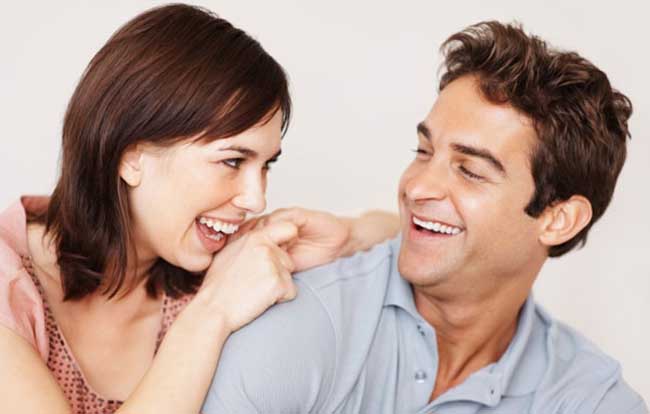 Portrait of a playful young couple looking at eachother