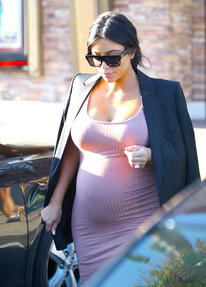 Kim Kardashian hugging dress