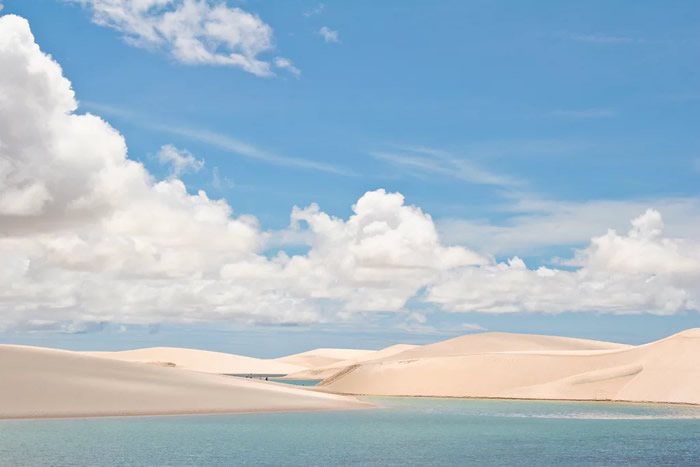 Swim in the sand dune lakes of Brazil after rainy season.