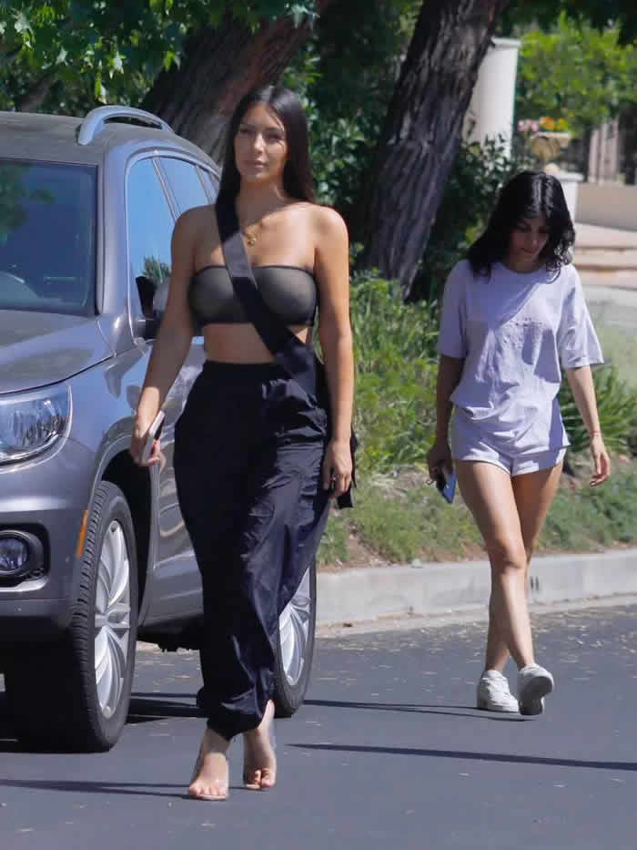 Kim Kardashian Flashes Her Nipples In Skimpy Crop Top As She Runs