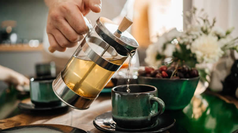 man drinks tea