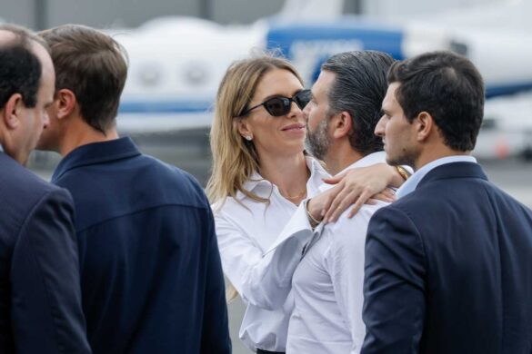 Bettina Anderson and Donald Trump Jr walk on the tarmac before first lady Melania Trump and US President Donald Trump on July 13, 2025, in Teterboro, New Jersey (Chip Somodevilla/Getty Images)
